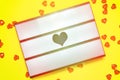 Flat lay of Lightbox on yellow background, room for text, ValentineÃ¢â¬â¢s Day concept